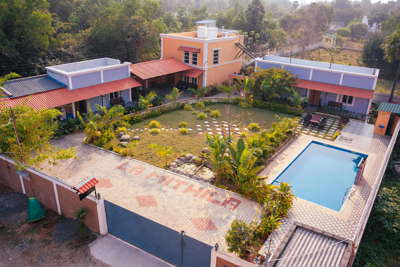 La Mithila Resort Pondicherry - aerial drone view showing pool and garden