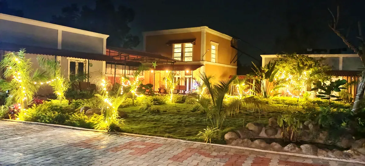 La Mithila Resort Pondicherry - garden lawn with fairy lights at night