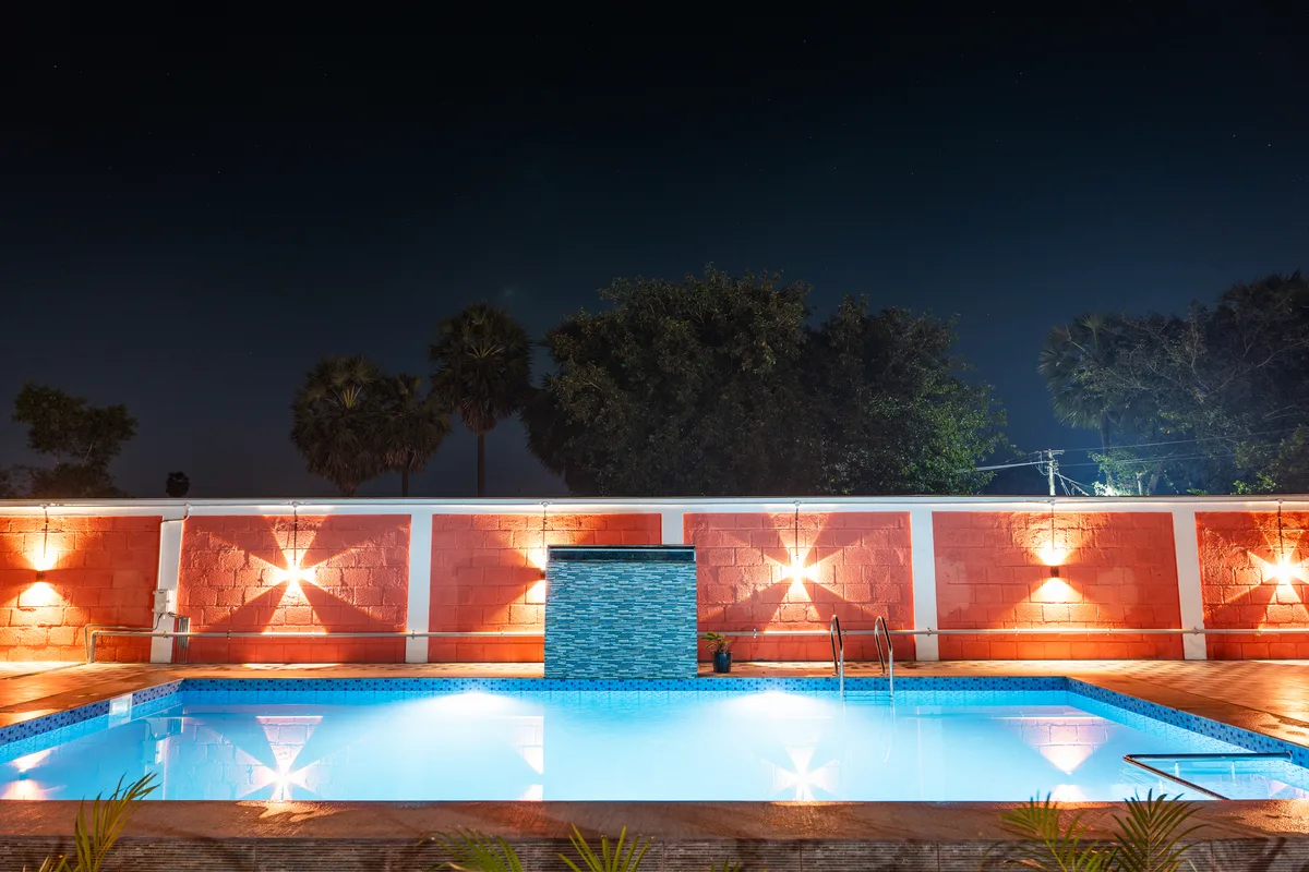 La Mithila Resort Pondicherry - pool with ambient lighting