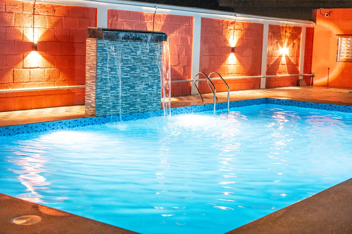 La Mithila Resort Pondicherry - swimming pool lit at night