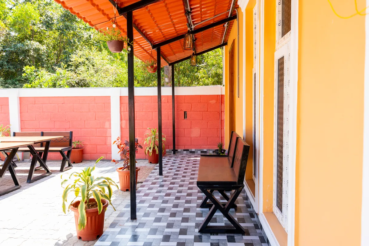 La Mithila Resort Pondicherry - sit-out seating area overlooking garden