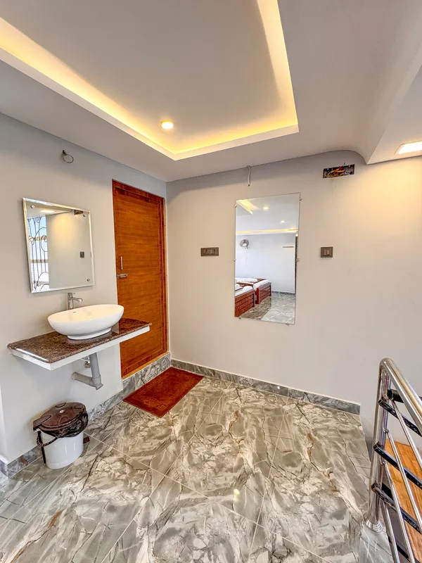 La Mithila Resort Pondicherry - suite room dining table and sofa